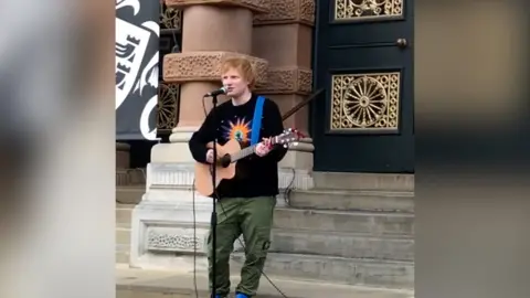 Ed Sheeran playing guitar