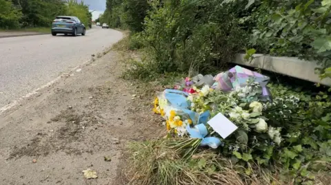 Flowers at scene of crash at New Barn Road in Southfleet