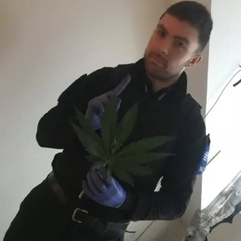 James Butterfield/Twitter James Butterfield holding a cannabis leaf