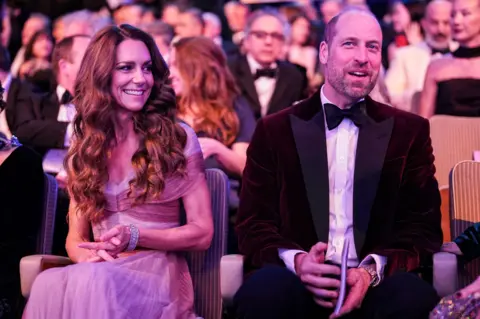 Getty Images Catherine, Princess of Wales and William, Prince of Wales in smart clothes, seated at the Baftas