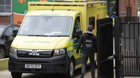PA Media Four replacement ambulances, which are on loan from the London Ambulance Service (LAS), arrive at the the Jewish Community Ambulance service in Golders Green, London