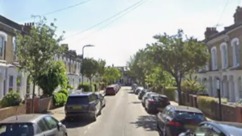 Residential road lined with houses