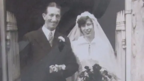 PA Media Pansy and Ivor Warren on their wedding day