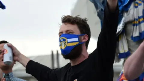 AFP/Getty Images A fan wearing a Leeds United face mask