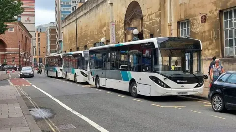 Transpora Transpora buses lined up on a city centre street