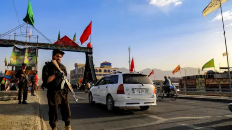 REX/Shutterstock Taliban stand guard near a Shiite Muslims Mosque during Ashura Day in Kabul, Afghanistan