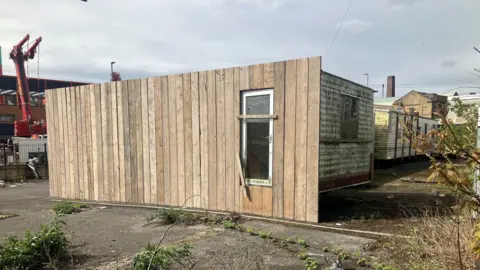 The caravans with wooden cladding on Thornton Road
