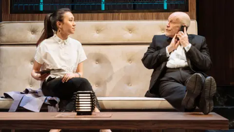 Manuel Harlan Ioanna Kimbrook as Yung Kim Li and John Malkovich as Barney Fein