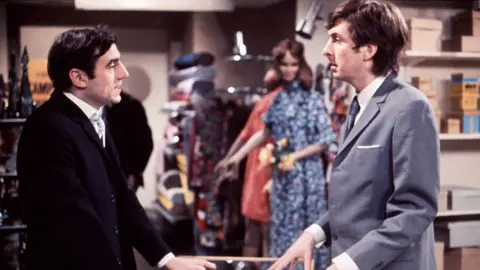 Monty Python Jones (left) as the store manager and Eric Idle as Chris Quinn in Monty Python's sketch 'The Department Store-Buying an Ant