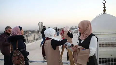 Youssef Badawi / EPA Syrians observe through telescopes