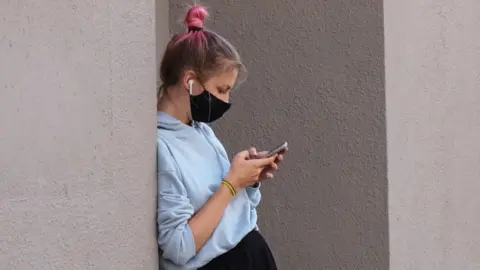 Reuters Woman using a phone