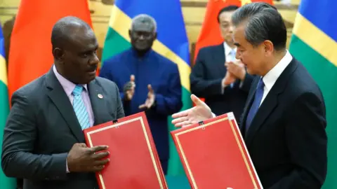 Getty Images Solomon Islands Prime Minister Manasseh Sogavare attends a meeting with Chinese Premier Li Keqiang