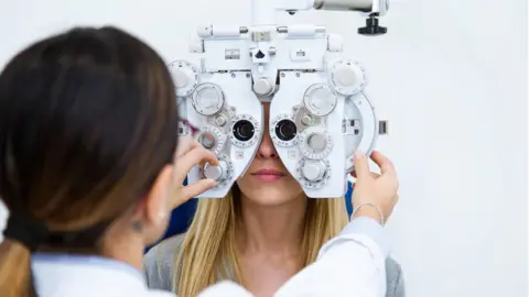 Getty Images A woman getting an eye test