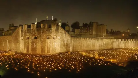 Getty Images Thousands of torches lit up the moat of the Tower of London to mark one hundred years since the end of the war