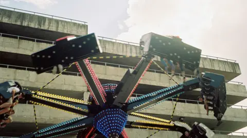 Tracy Hickinbottom Fairground ride next to a Stourbridge multi-storey car park