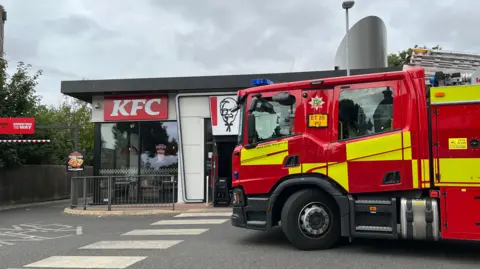 Fire engine in front of KFC store