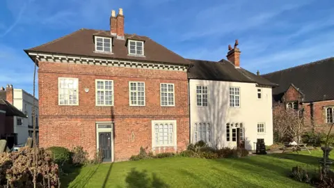 The Schoolmaster's House seen from the garden at the side of the property in St John Street.