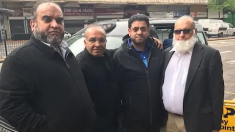 Raja Amin (second left) and Sajid Hussain (second right) with other drivers