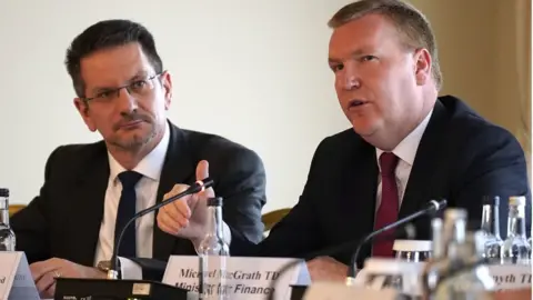 Niall Carson/PA Media Northern Ireland Office minister Steve Baker (left) listening to Irish Minister for Finance Michael McGrath during the Kildare meeting