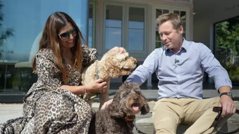 Jamie Niblock/BBC Mr and Mrs Burgess with dogs Dora (top) and Olive (bottom)