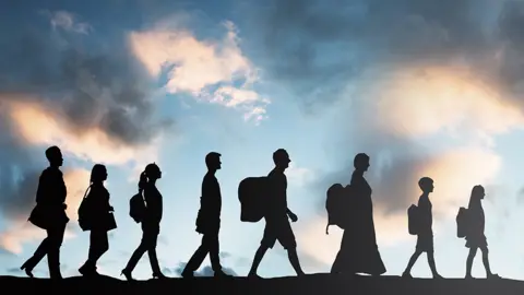 Getty Images People walking in a line