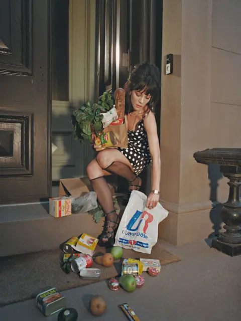 BMG Music/PA Album artwork showing Lily Allen stylishly dressed but having dropped her groceries
