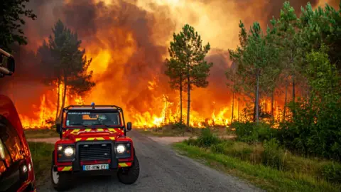 SDIS33/French fire service Firefighters tried to stop the flames reaching La Teste-de-Buch and thousands of residents were told to leave