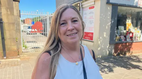 A woman in a white top 