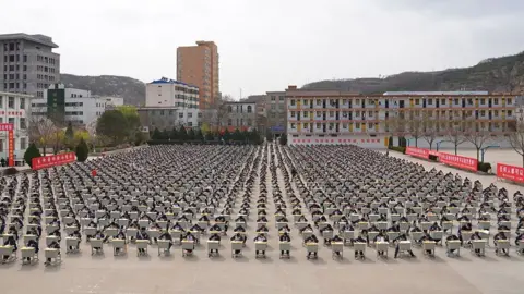 Getty Images More Than 1,700 students of Yichuan Middle School take an outdoor exam at the playground on April 11, 2015 in Yan'an, Shaanxi province of China.