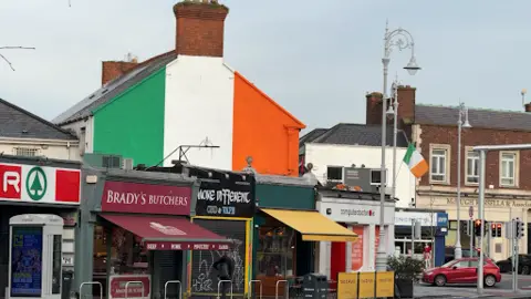 Irish tricolour painted on a gable wall 