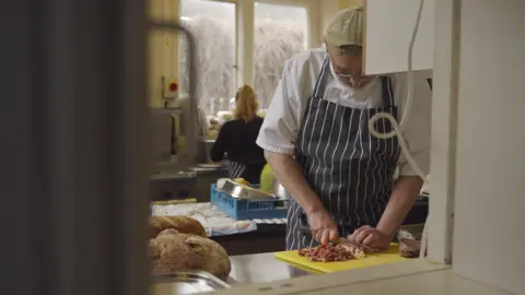 Mario Genovese  Man cooking meals for those in need