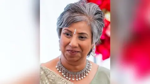 Leicestershire Police A head and shoulders picture of Nila Patel wearing silver jewellery round her neck and on the centre of her brow.
