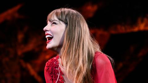 Taylor Swift smiles at the Cardiff crowd