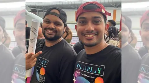 Dwayne Dias Dwayne Dias (left) and his friend pose for a photo at the concert venue in Singapore where they saw Coldplay live