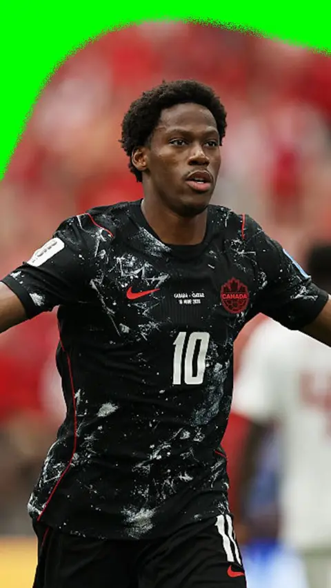 Jonathan David celebrates scoring for Canada