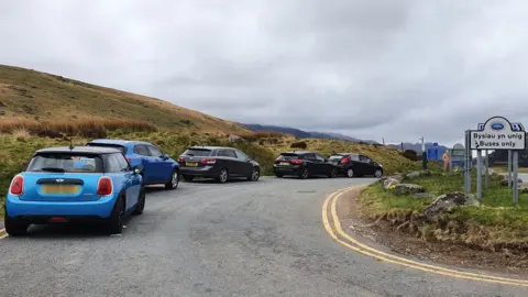 @Stiw__/Twitter Drivers also left their cars in a lay-by near the Pen-y-Gwryd Hotel, in Gwynedd