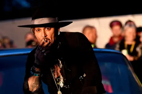 Dylan Martinez / Reuters Actor Johnny Depp smokes a cigarette for the camera