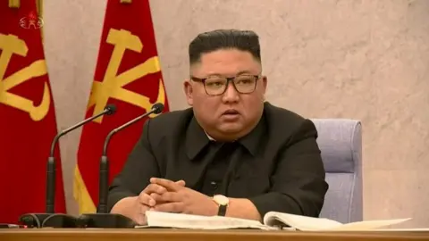 Reuters Kim Jong-un speaks at his party meeting on 12 February 2021