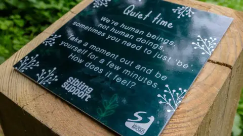 Sibling Support Signpost for the walk with advice about 'taking a moment'