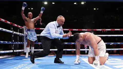Fabio Wardley celebrates with Justis Huni on his knees
