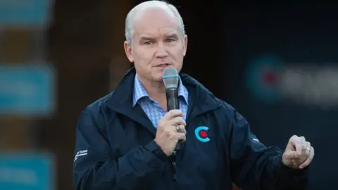 AFP via Getty Images Canada's Conservative Party leader Erin O'Toole speaks to a crowd of supporters as he campaigns