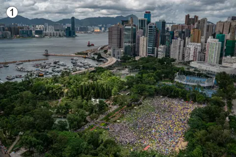 Getty Images This sweeping panorama of Hong Kong, overlooking Victoria park, shows hundreds if not thousands of people staged for the march in the morning or early afternoon.