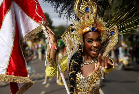 Hollie Adams / Reuters A samba dancer takes part in the Notting Hill Carnival in London.