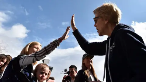 Getty Images Democratic presidential candidate Sen. Elizabeth Warren (D-MA) greets supporters during a visit to a caucus site at Coronado High School on February 22, 2020 in Henderson, Nevada