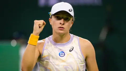 Iga Swiatek celebrates win