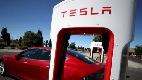 Getty Images A stock photograph of a Tesla Supercharger in California