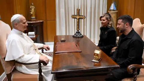 Ukraine's President Volodymyr Zelenskiy and his wife Olena Zelenska meet with Pope Leo XIV on the day of his inaugural Mass in St. Peter's Square, at the Vatican, May 18, 2025