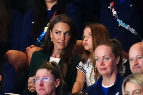 PA Media The Princess of Wales, known as the Duchess of Rothesay when in Scotland, with Princess Charlotte during the netball semi-final match