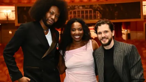 Getty Images Playwright Jeremy O. Harris and cast members Olivia Washington and Kit Harington pose backstage following the press night performance of "Slave Play" at the Noel Coward Theatre on July 10, 2024 in London, England