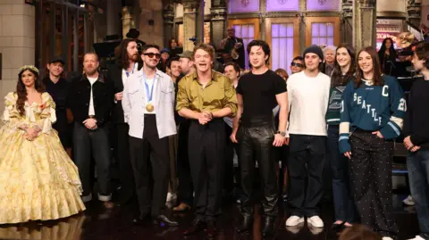 Getty Images Saturday Night Live cast and hosts gathered on set on 28 February